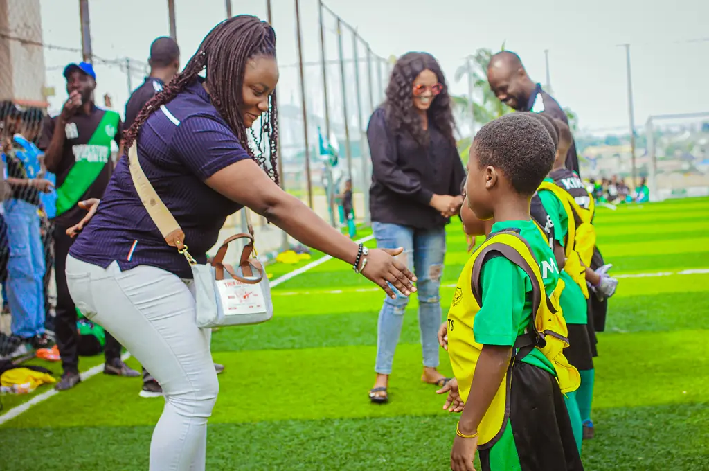 Parents greeting young players at a Madestone family day