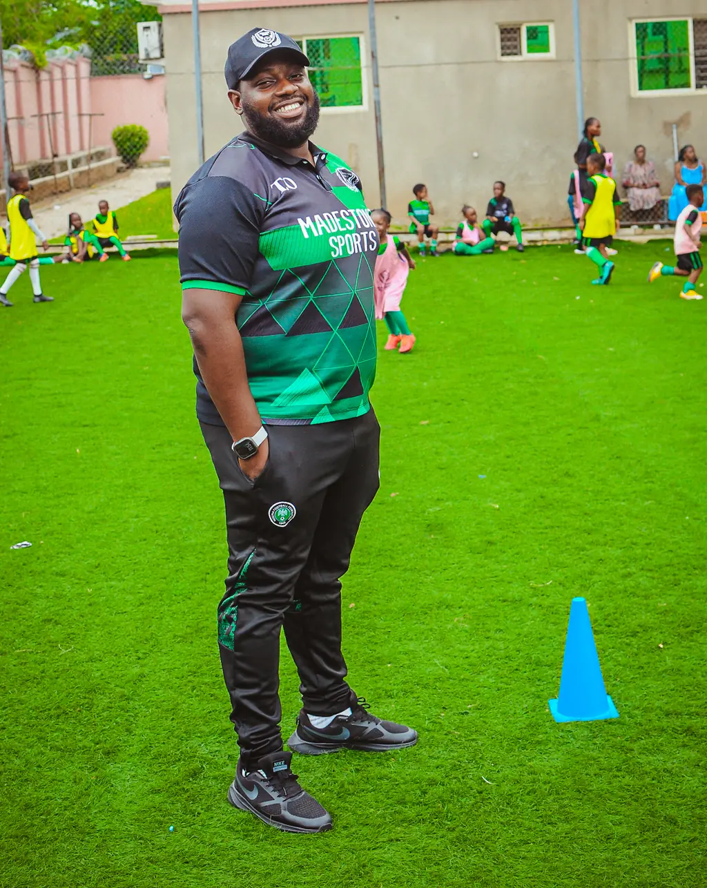 A Madestone coach on the pitch during a training session
